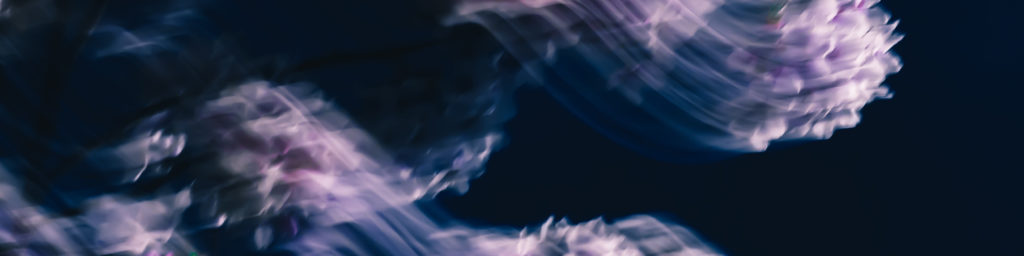Abstract blue and purple flowing ethereal design with soft cloud-like shapes, conveying a spiritual or meditative atmosphere.