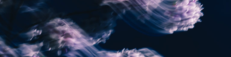 Abstract blue and purple flowing ethereal design with soft cloud-like shapes, conveying a spiritual or meditative atmosphere.