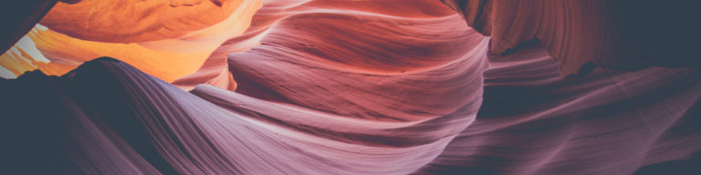 Native American Ministries Sunday banner featuring a photograph of red, orange, and purple layered canyon rock formations with warm natural light.