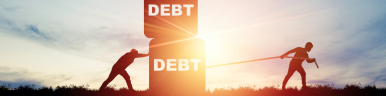 Two silhouettes pulling a block labeled 'DEBT' during sunset, representing the struggle against financial burden and debt relief efforts.
