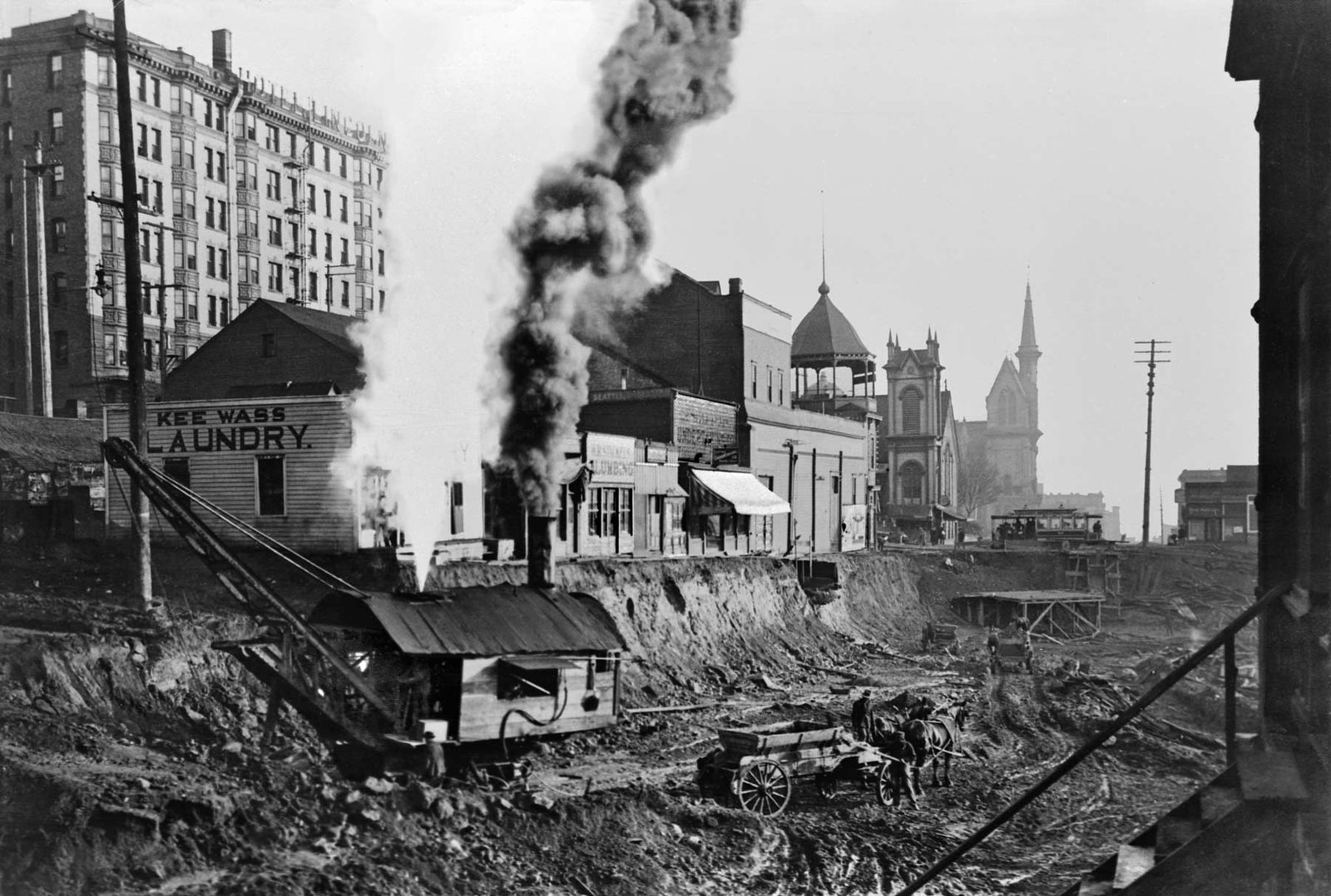 Denny regrade construction in 1903 with the church in the background