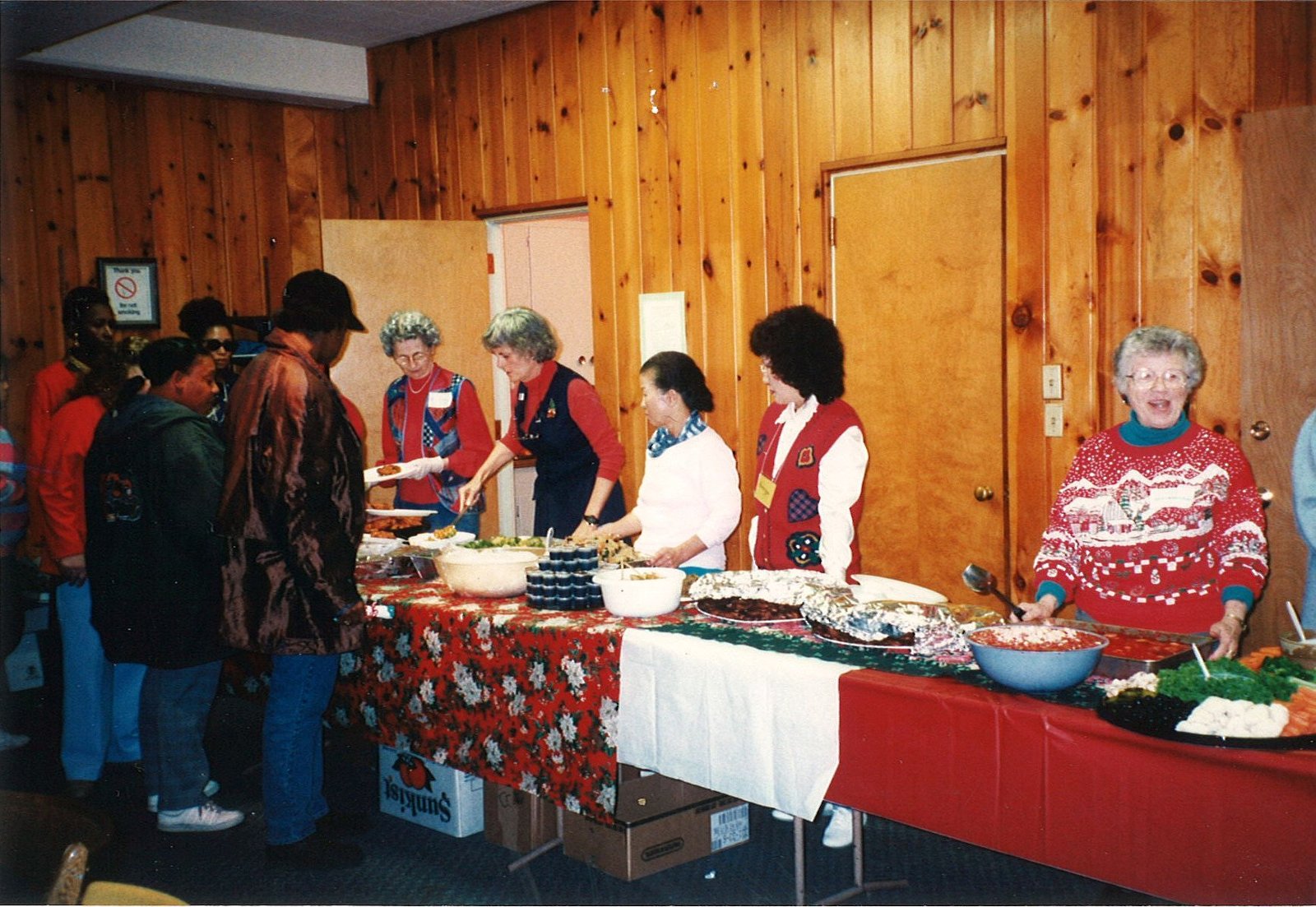 Volunteers serving lunch at the Church of Mary Magdalene worship for homeless women