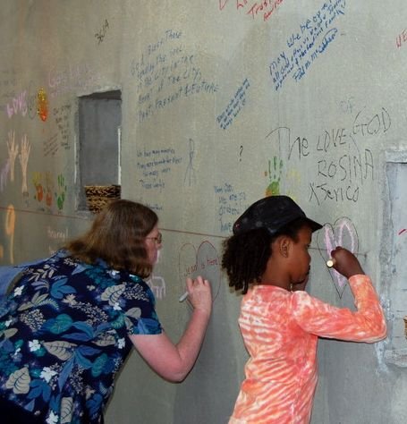Congregation members signing the walls of the new church building in 2009
