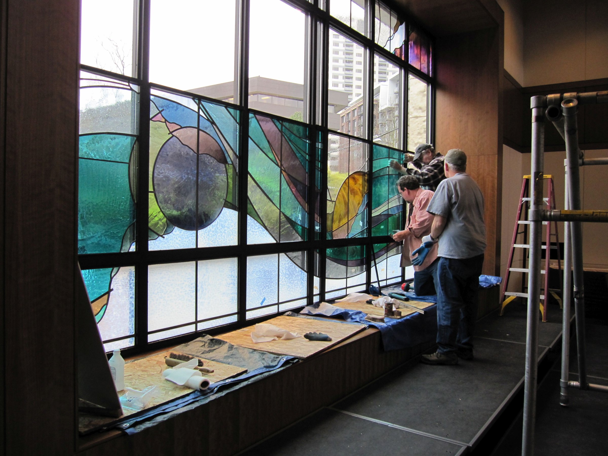 Crew installing the New Heaven stained glass window in the sanctuary, 2010